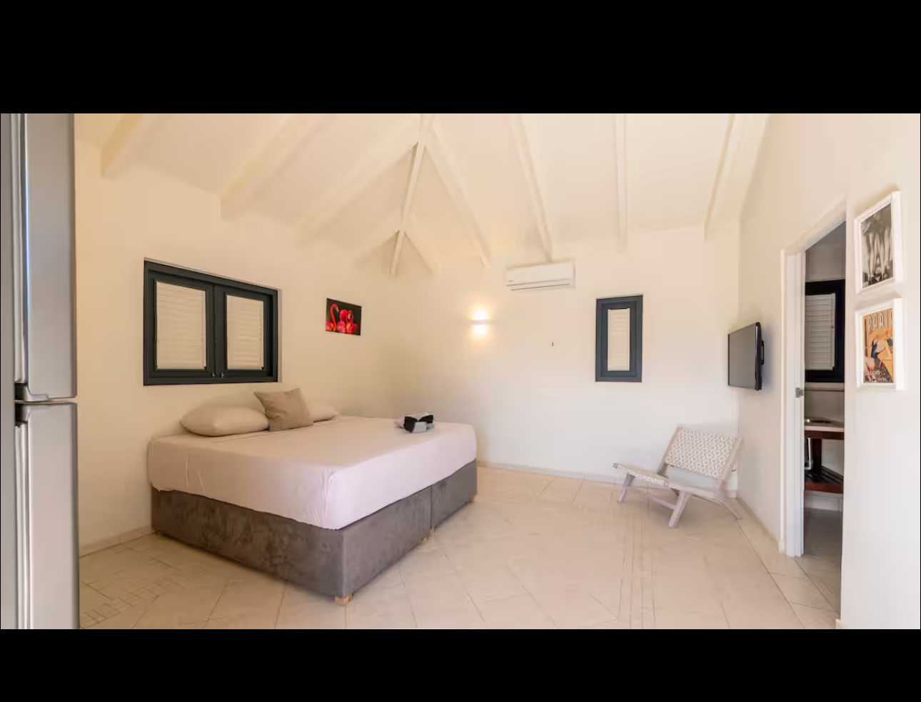 Air-conditioned bedroom with a vaulted ceiling