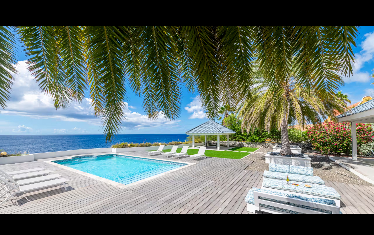 Villa Kokolishi pool terrace overlooking the Caribbean Sea